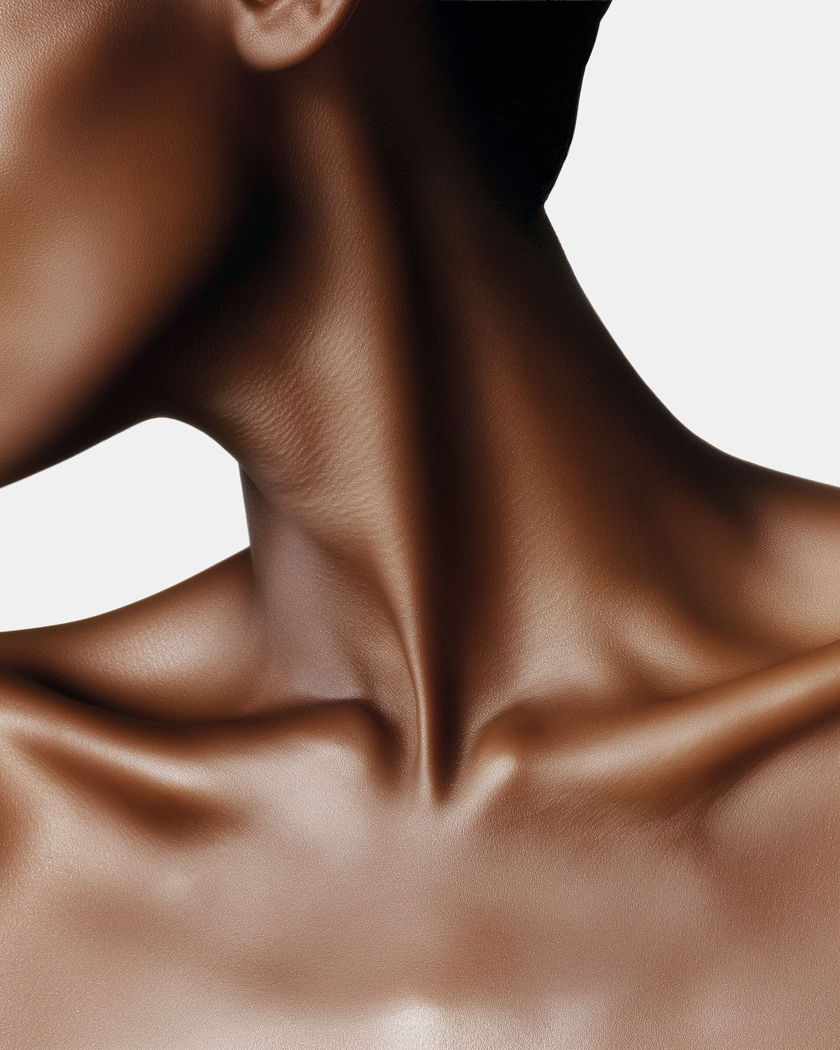 Person's neck and shoulder with smooth glowing skin