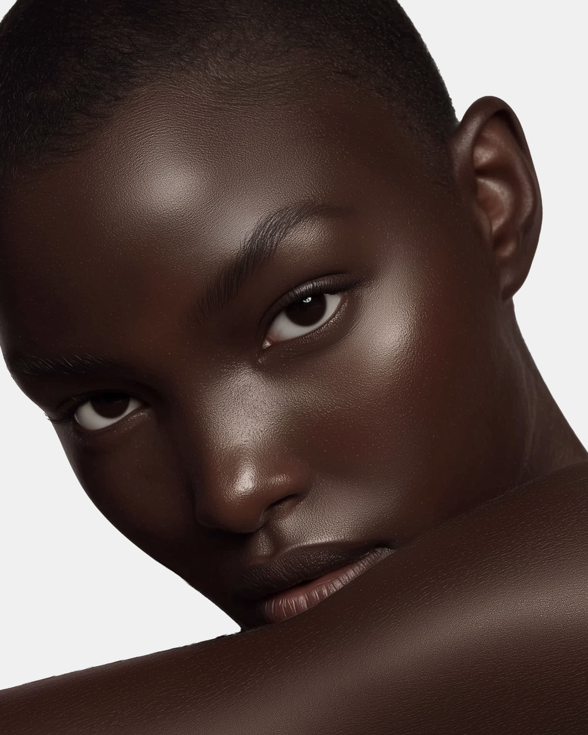 Person with glowing smooth skin in profile close-up