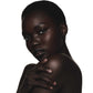 Black woman with a neutral expression on a white background
