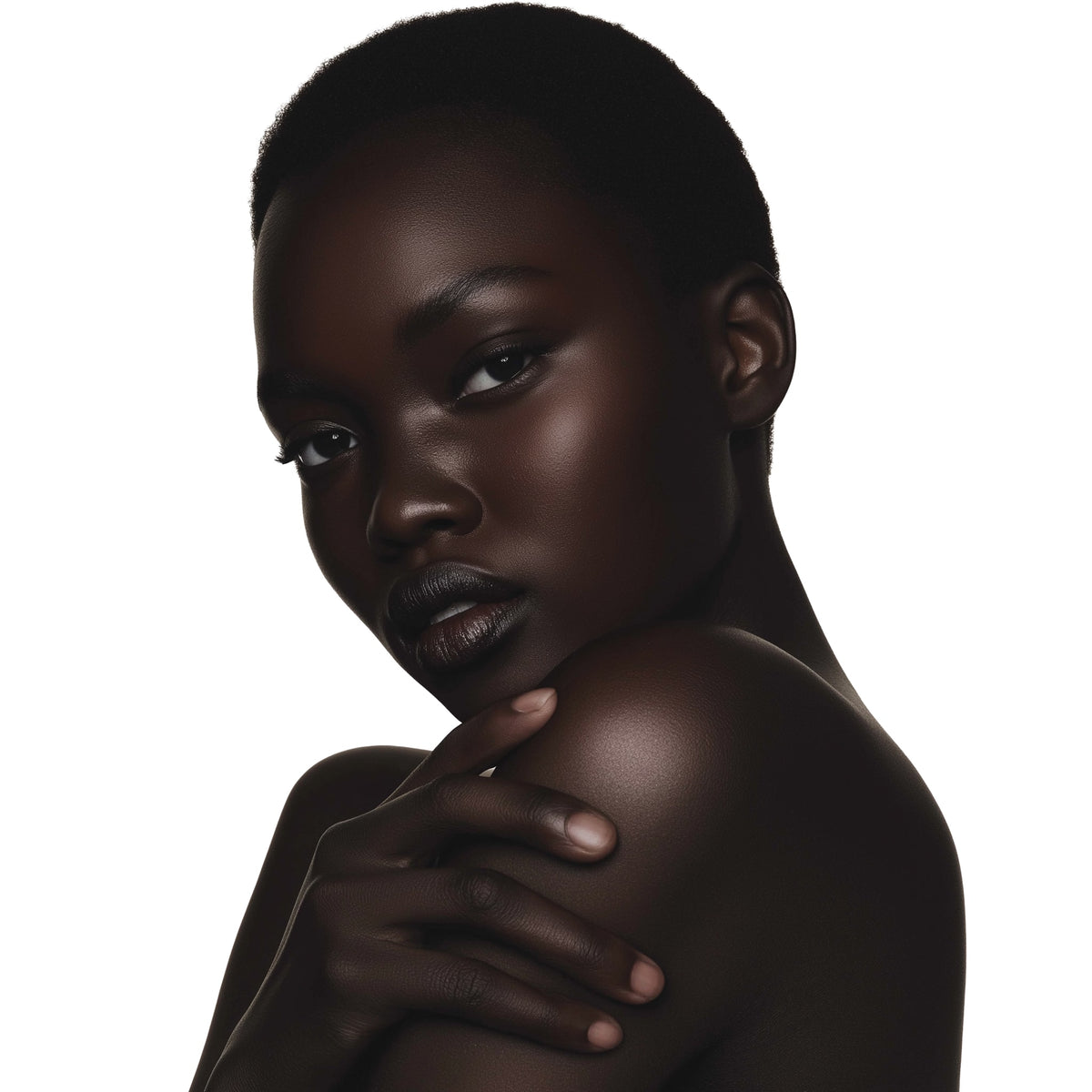 Black woman with a neutral expression on a white background