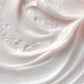 Close-up of pink whipped cream with a soft focus background
