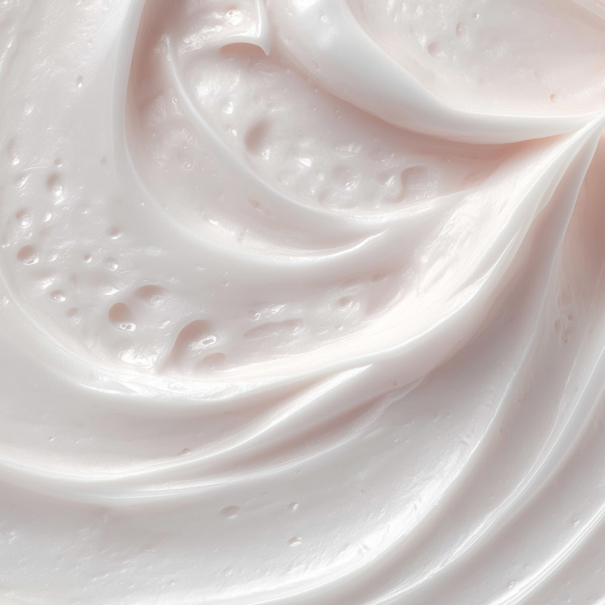 Close-up of pink whipped cream with a soft focus background