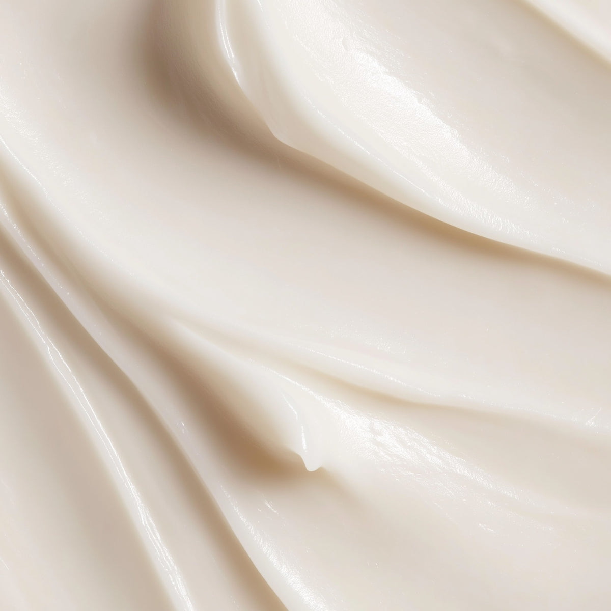 Close-up of smooth, beige fabric with soft folds