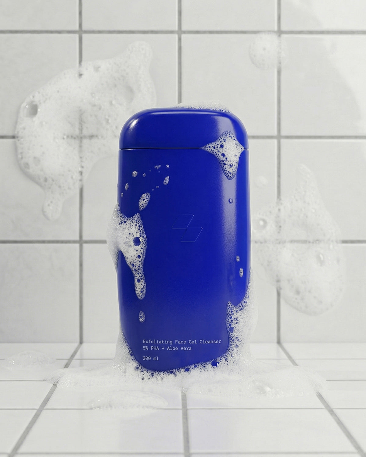 Blue bottle with soap suds on a tiled bathroom wall