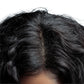Close-up of a person's head with black hair on a white background