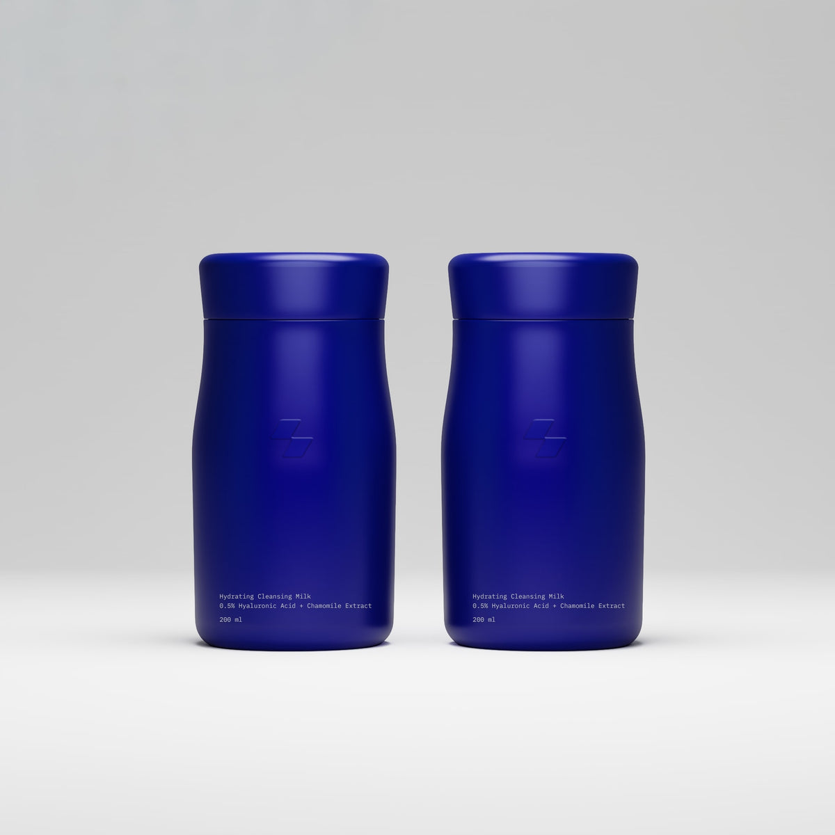 Two blue cylindrical containers on a light gray background