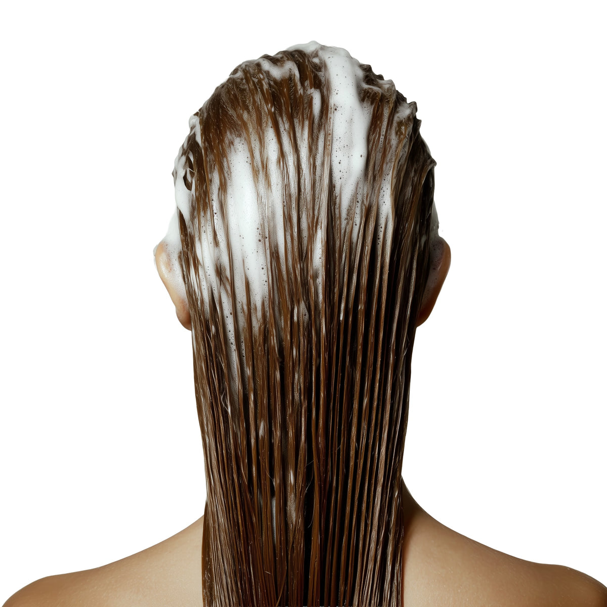 Person with brown hair covered in white shampoo on a white background