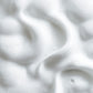 Close-up of white whipped cream with a soft focus