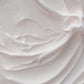 Soft white cream texture with swirled ridges