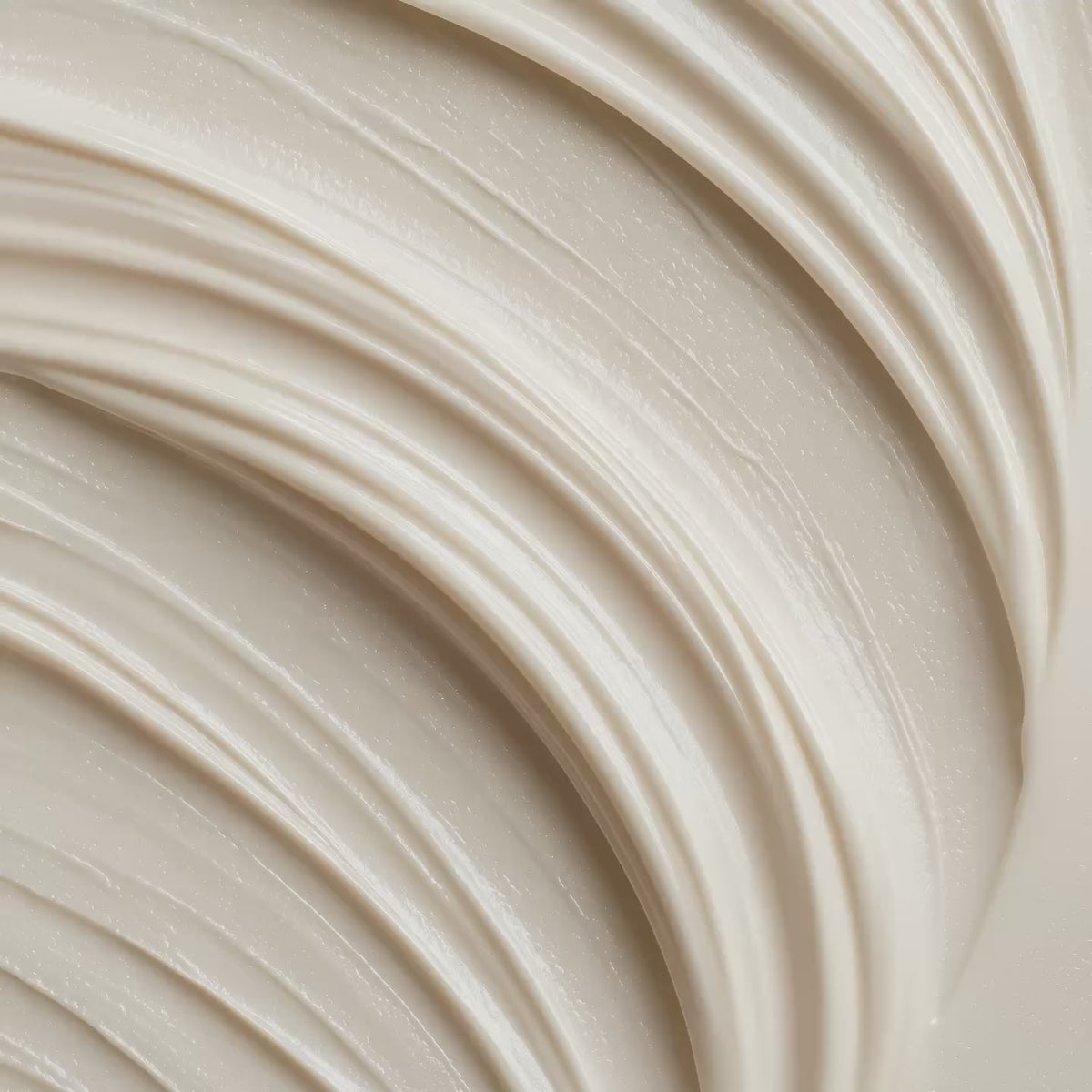 Smooth beige moisturizing cream with soft swirled texture