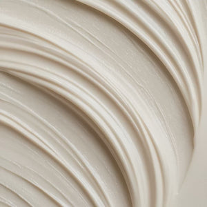 Smooth beige moisturizing cream with soft swirled texture