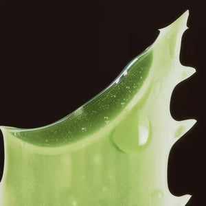 Green gel skincare product with glittering particles and smooth texture on black background