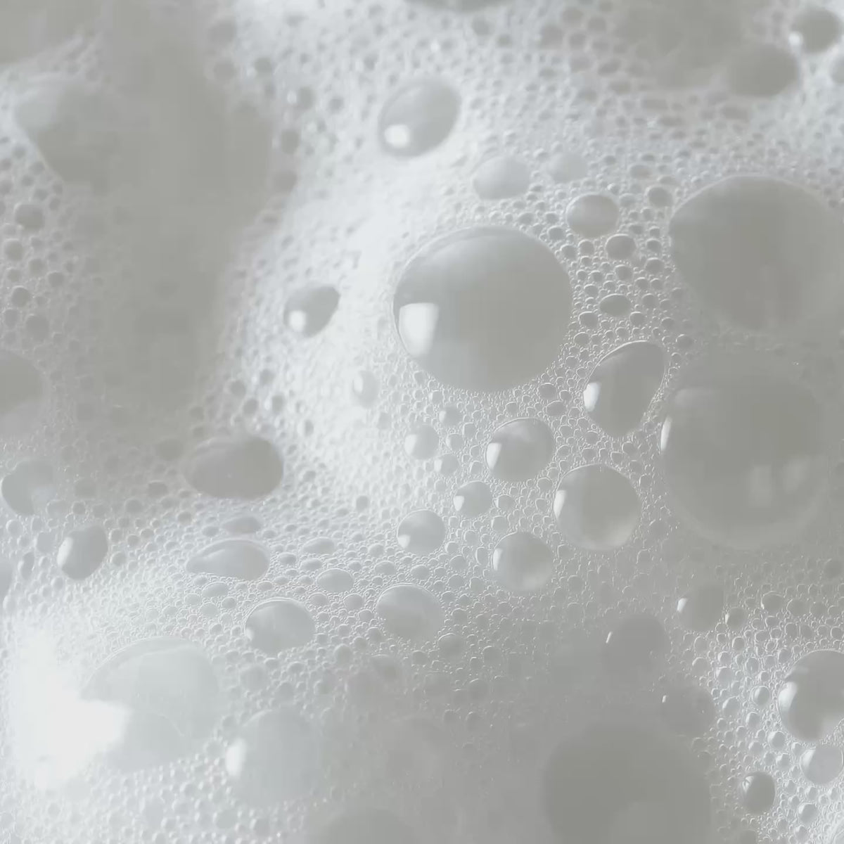 Close-up of white foam and bubbles from cleansing product