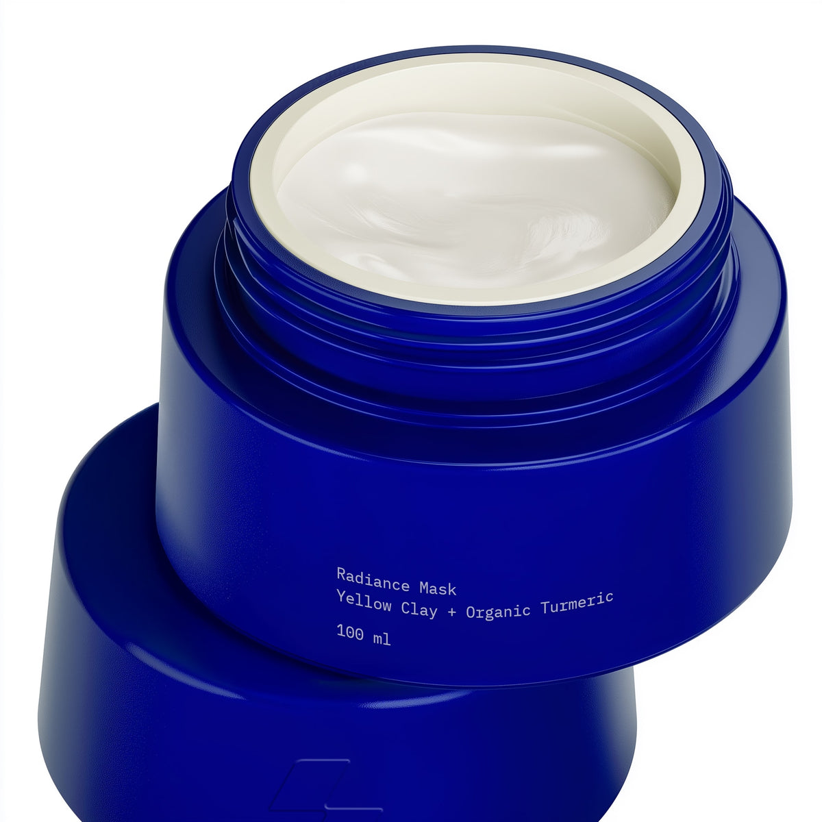 Blue jar of radiance mask with white cream inside on a white background