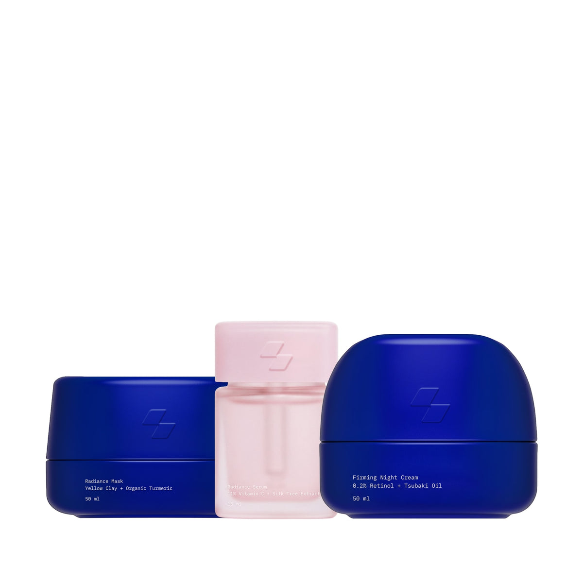 Three skincare products in blue, pink, and purple containers on a white background