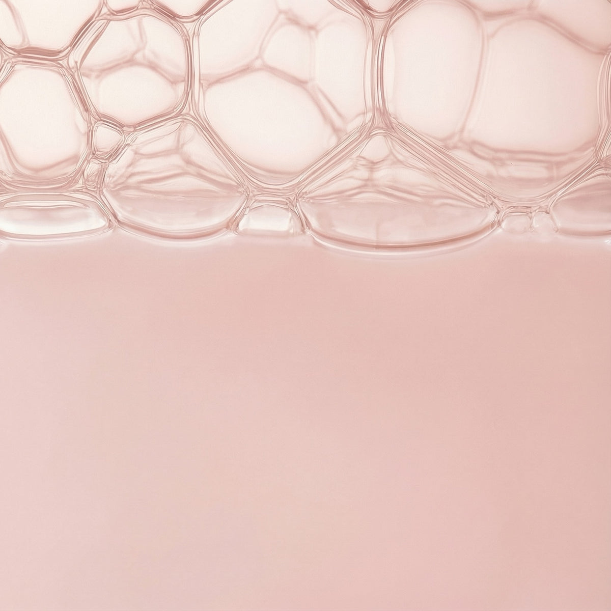 Close-up of a pink textured surface with a honeycomb pattern