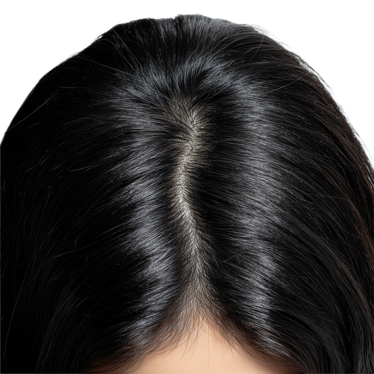 Close-up of a person's head with dark hair on a white background