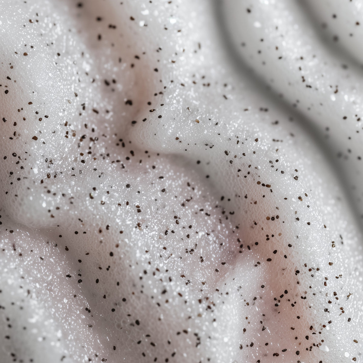 Close-up of a creamy texture with black specks