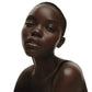 Dark-skinned woman with a soft glow on a white background