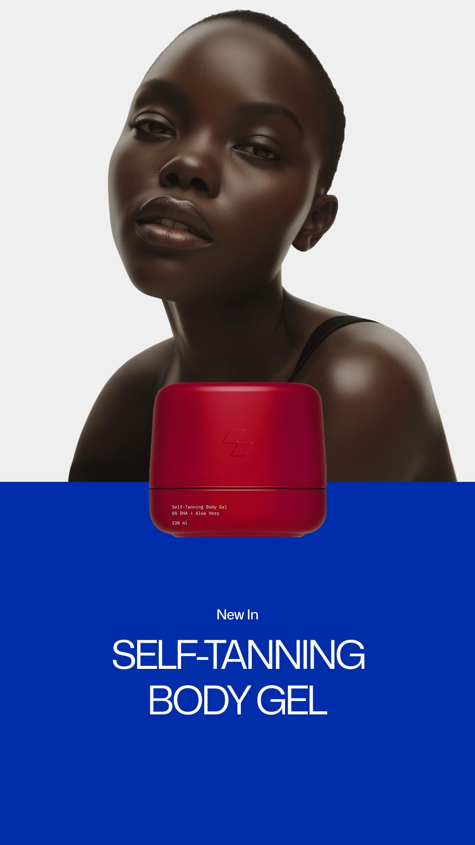 Person with a red self-tanning body gel container on a blue and gray background
