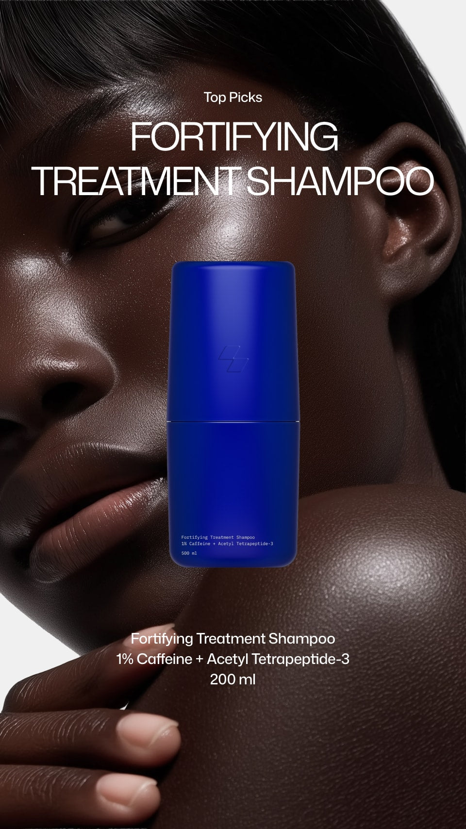 Blue shampoo bottle with text about fortifying treatment shampoo on a dark background