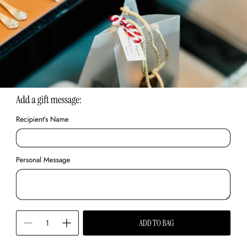 Gift packaging with a tag and text input fields for adding a gift message on a website.