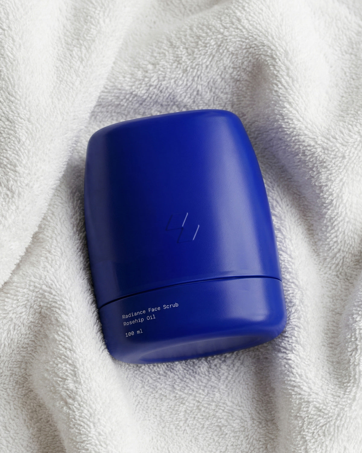 Blue container on a white towel